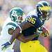 Michigan senior tight end Kevin Koger runs the ball around Eastern Latarrius Thomas during the first half against Eastern Michigan at Michigan Stadium on Saturday. Melanie Maxwell I AnnArbor.com